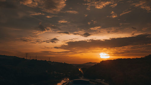 Scenic view of silhouette landscape against sky during sunset