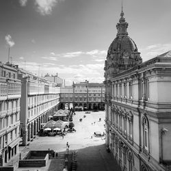 Buildings in city against sky