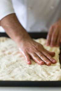 Close-up of chef preparing food