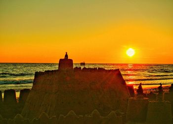 Scenic view of sea at sunset