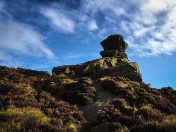 Low angle view of statue against sky