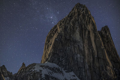 Low angle view of mountain against sky at night