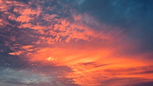 Low angle view of dramatic sky during sunset