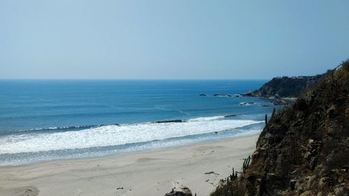 Scenic view of sea against clear sky