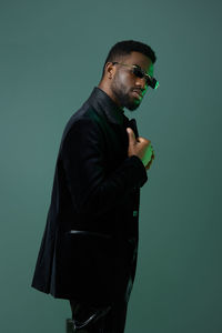 Low angle view of man standing against clear sky