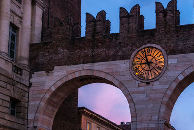Low angle view of clock tower against sky