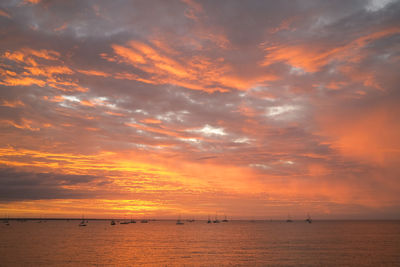 Scenic view of sea against orange sky