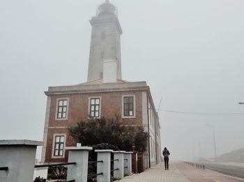 Low angle view of building against sky during winter