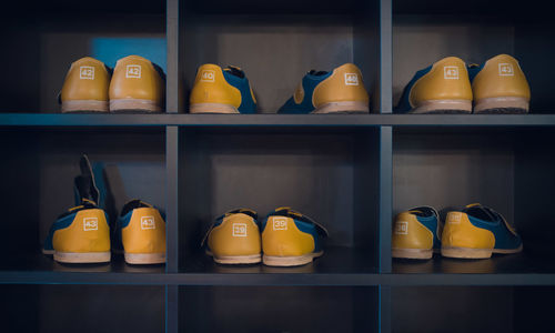 Close-up of various shoes in shelf