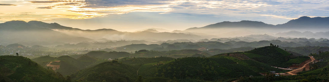 Panoramic view of mountains against sky during dawn