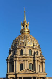 Low angle view of building against blue sky