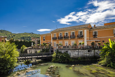 Buildings in city against sky