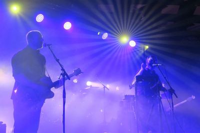 Panoramic view of people playing at music concert