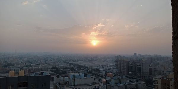 High angle view of townscape against sky during sunset