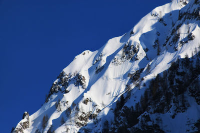 Scenic view of snow covered mountains