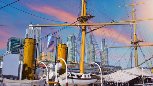 Low angle view of amusement park against sky