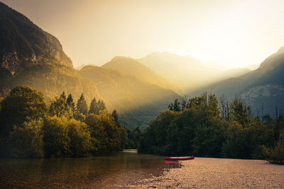 Scenic view of lake against sky during sunset