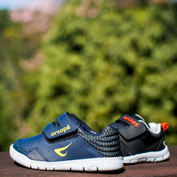 Close-up of shoes on field