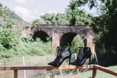 View of an abandoned and bridge against sky