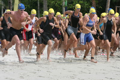 Athletes running at beach