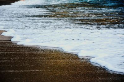 Close-up of surf on beach