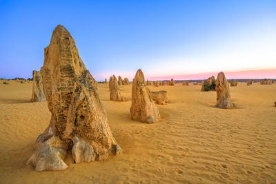 Panoramic view of desert against clear sky