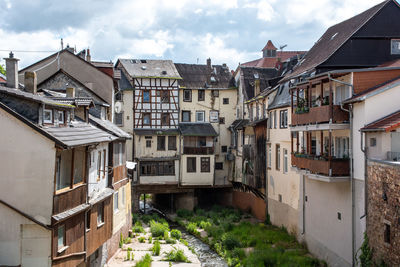 Houses in town against sky