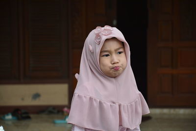 Portrait of cute girl wearing mask