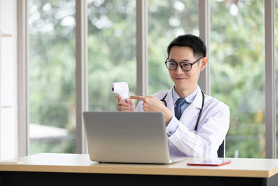 Man using laptop on table