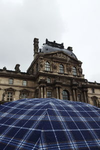 Low angle view of historical building against sky in city