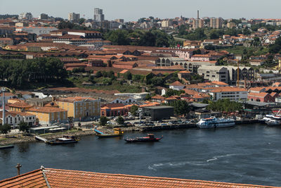 High angle view of harbor by buildings in city