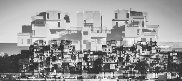 Close-up of modern buildings against sky
