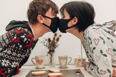 Man and woman having food at home