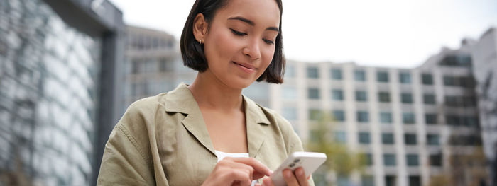 Young woman using mobile phone