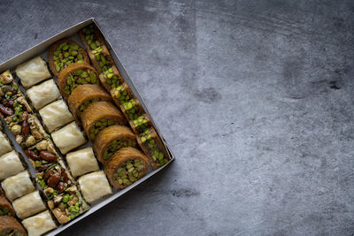 Arabic and turkish oriental sweets desserts made of pistachios and kunafa with leafy dough