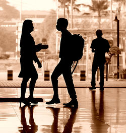 Silhouette people in corridor