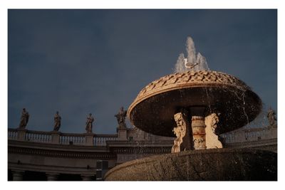 Low angle view of statue against sky