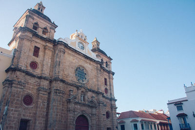 Low angle view of buildings against clear sky