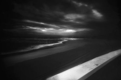Scenic view of sea against cloudy sky