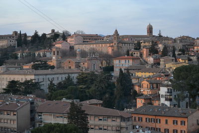 Buildings in city against sky