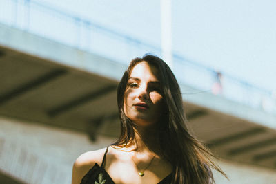 Portrait of a young woman looking away