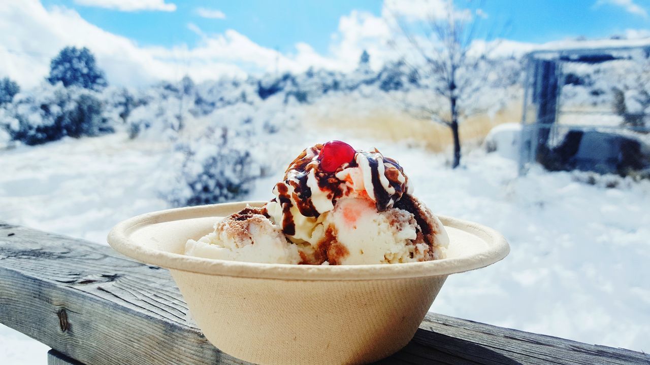 CLOSE-UP OF ICE CREAM CONE IN WINTER