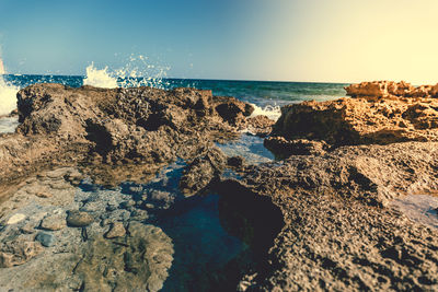 Scenic view of sea against clear blue sky