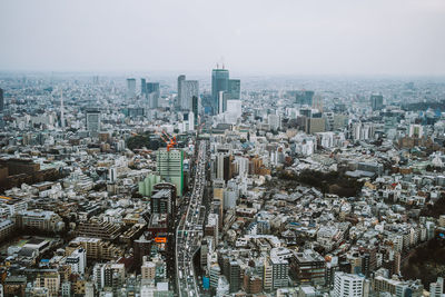 High angle view of modern buildings in city against sky