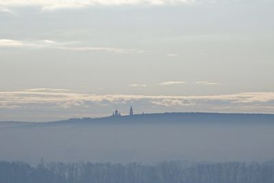 Scenic view of factory against sky