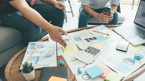 People working on table in office