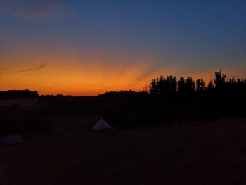 Scenic view of silhouette landscape against sky during sunset