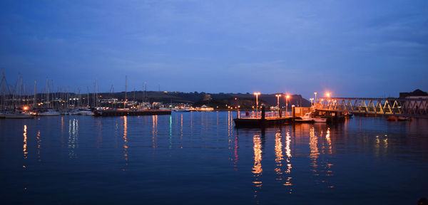 Boats moored at harbor