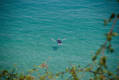 High angle view of man swimming in sea