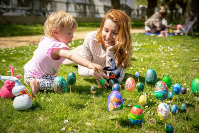 Portrait of smiling boy playing with easter egg